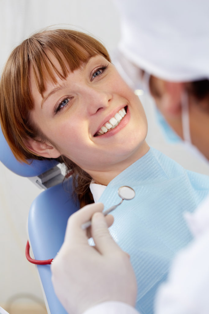 woman receiving orthodontics treatment with a perfect smile