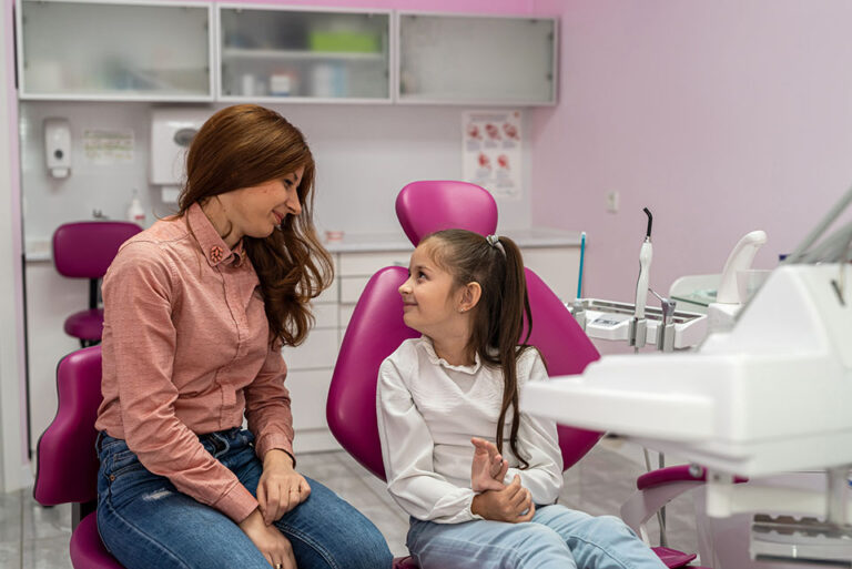 mom and child in orthodontist office before their free orthodontic consultation