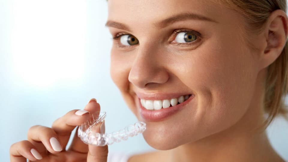 Woman with Invisalign and AcceleDent
